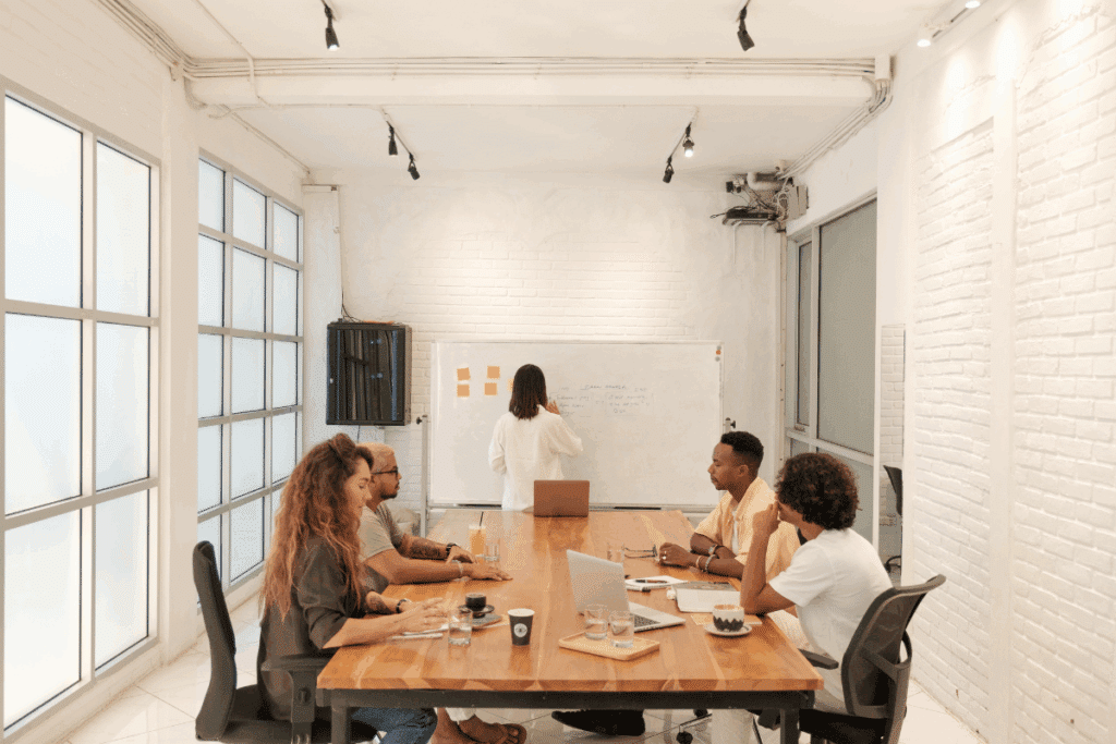 Business team in a strategy meeting, with the second-in-command leading the discussion.
